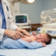 Pediatrician examining newborn for jaundice in newborns at Balya Hospital Vijayawada